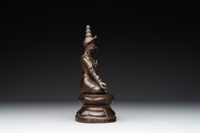 A Vietnamese bronze deity on a lotus throne, 18/19th C.