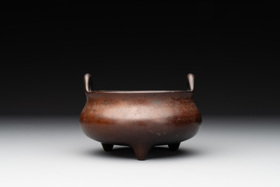 A Chinese bronze tripod censer, Xuande mark, Ming