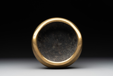 A Chinese bronze tripod censer on a wooden stand, Song Zhu Xuan 松竹軒 mark, 18th C.