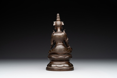 A Vietnamese bronze deity on a lotus throne, 18/19th C.