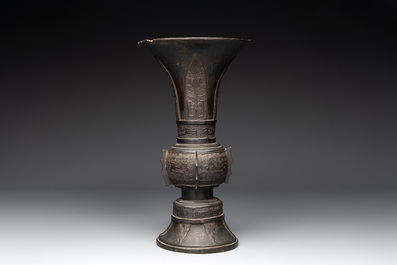 A Chinese archaistic bronze 'gu' vase with relief design, Ming