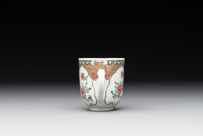 A fine Chinese famille rose armorial cup and two saucers, Yongzheng/Qianlong