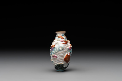 A Chinese famille rose molded 'capsized boat' snuff bottle, Qianlong mark, 19th C.