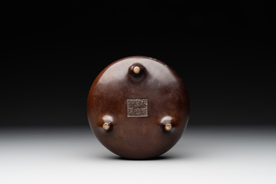 A Chinese bronze tripod censer, Xuande mark, Ming