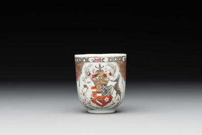 A fine Chinese famille rose armorial cup and two saucers, Yongzheng/Qianlong