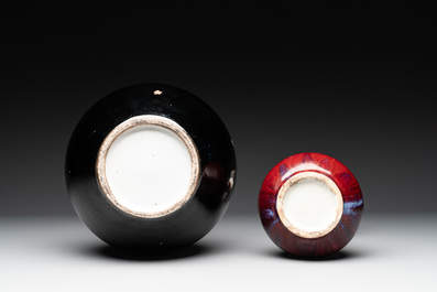 A Chinese black-glazed 'tianqiu ping' vase and a flamb&eacute;-glazed bottle vase, 19/20th C.