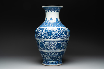 A large Chinese blue and white 'flower scroll' vase, Qianlong mark, 19th C.