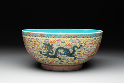 A Chinese famille rose turquoise-and-yellow-ground 'dragon' bowl on wooden stand, Qianlong mark, Republic