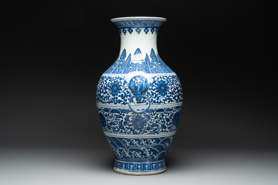 A large Chinese blue and white 'flower scroll' vase, Qianlong mark, 19th C.