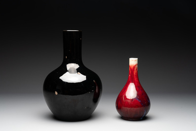 A Chinese black-glazed 'tianqiu ping' vase and a flamb&eacute;-glazed bottle vase, 19/20th C.