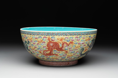 A Chinese famille rose turquoise-and-yellow-ground 'dragon' bowl on wooden stand, Qianlong mark, Republic