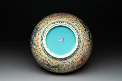 A Chinese famille rose turquoise-and-yellow-ground 'dragon' bowl on wooden stand, Qianlong mark, Republic