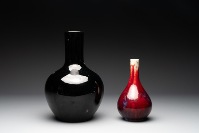 A Chinese black-glazed 'tianqiu ping' vase and a flamb&eacute;-glazed bottle vase, 19/20th C.
