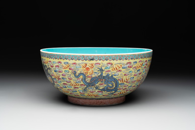 A Chinese famille rose turquoise-and-yellow-ground 'dragon' bowl on wooden stand, Qianlong mark, Republic