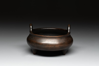 A Chinese bronze tripod censer, Xuande mark, 17/18th C.