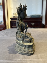 A Chinese bronze seated Bodhisattva on a lotus throne, Ming