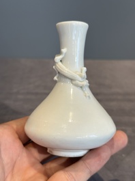 A small Chinese Dehua blanc de Chine 'dragon' bottle vase, Kangxi