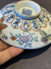 An exceptional Chinese gilt-decorated doucai and famille rose covered bowl with butterflies and floral design, Jiaqing mark and of the period