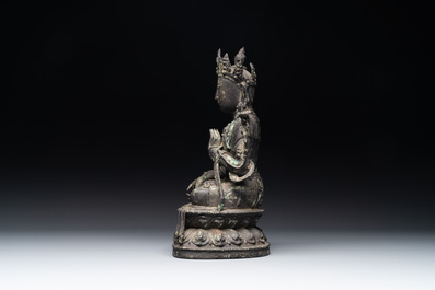 A Chinese bronze seated Bodhisattva on a lotus throne, Ming