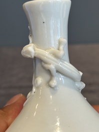 A small Chinese Dehua blanc de Chine 'dragon' bottle vase, Kangxi