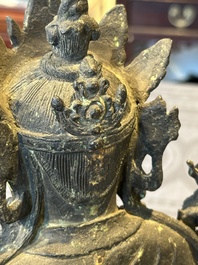 A Chinese bronze seated Bodhisattva on a lotus throne, Ming