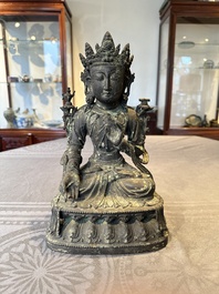 A Chinese bronze seated Bodhisattva on a lotus throne, Ming