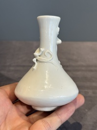 A small Chinese Dehua blanc de Chine 'dragon' bottle vase, Kangxi