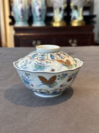 An exceptional Chinese gilt-decorated doucai and famille rose covered bowl with butterflies and floral design, Jiaqing mark and of the period