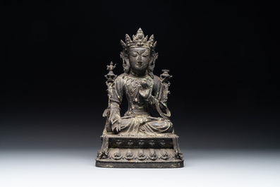 A Chinese bronze seated Bodhisattva on a lotus throne, Ming