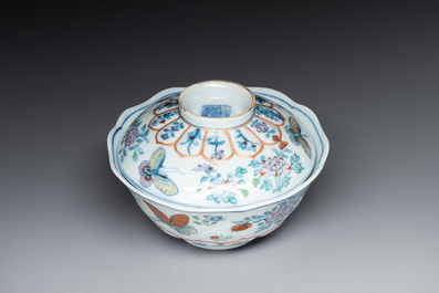 An exceptional Chinese gilt-decorated doucai and famille rose covered bowl with butterflies and floral design, Jiaqing mark and of the period