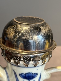 A Chinese silver-mounted blue and white 'Mongolian hunt' ewer, Transitional period