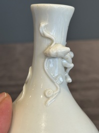 A small Chinese Dehua blanc de Chine 'dragon' bottle vase, Kangxi