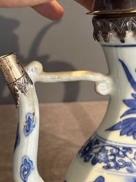 A Chinese silver-mounted blue and white 'Mongolian hunt' ewer, Transitional period
