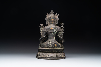 A Chinese bronze seated Bodhisattva on a lotus throne, Ming