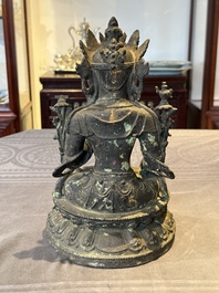 A Chinese bronze seated Bodhisattva on a lotus throne, Ming
