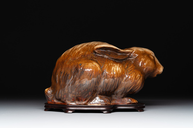 A fine Chinese cafe-au-lait glazed hare on wooden stand, Tian 天 mark, Qing