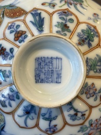 An exceptional Chinese gilt-decorated doucai and famille rose covered bowl with butterflies and floral design, Jiaqing mark and of the period