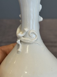 A small Chinese Dehua blanc de Chine 'dragon' bottle vase, Kangxi