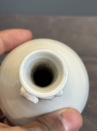 A small Chinese Dehua blanc de Chine 'dragon' bottle vase, Kangxi