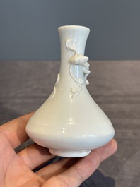 A small Chinese Dehua blanc de Chine 'dragon' bottle vase, Kangxi