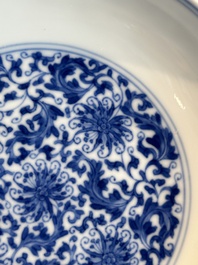 A Chinese blue and white 'flower scroll' plate, Yongzheng mark and of the period