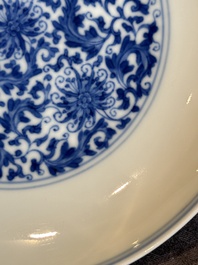 A Chinese blue and white 'flower scroll' plate, Yongzheng mark and of the period