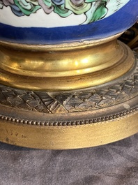 A Chinese famille verte powder blue-ground vase mounted as lamp, 19th C.