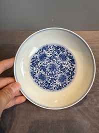A Chinese blue and white 'flower scroll' plate, Yongzheng mark and of the period