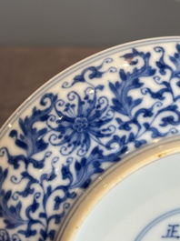 A Chinese blue and white 'flower scroll' plate, Yongzheng mark and of the period