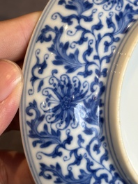 A Chinese blue and white 'flower scroll' plate, Yongzheng mark and of the period
