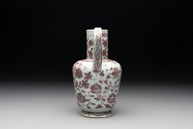 A Chinese copper-red and white 'flower scroll' ewer, Ming or later