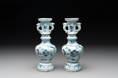A pair of Chinese blue and white handled vases with floral design, Ming