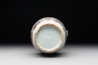 A Chinese copper-red and white 'flower scroll' ewer, Ming or later