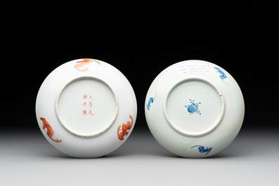 A Chinese iron-red 'bat' saucer and a black-glazed 'ship' saucer with calligraphy, Guangxu mark, 19th C.